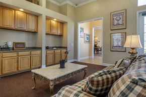 Naples apartment for rent - Clubhouse Seating Area with Decorations and Blonde Cabinets