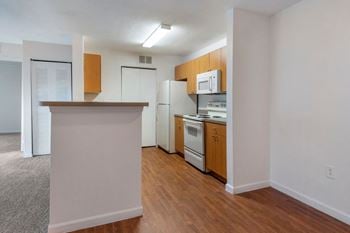 Fully equipped kitchen with white appliances