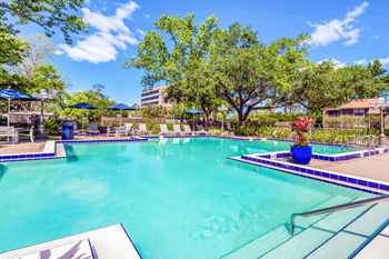 Four swimming pools with sundeck seating