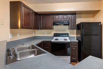 Kitchen with white and black appliances