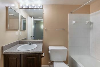 Tiled shower area with bathtub