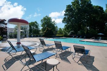 Swimming pool with sundeck and water feature