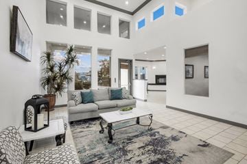 Glendale apartment for rent - A modern living room with a grey sofa and a white coffee table.