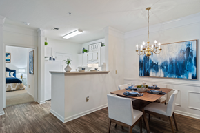 Lawrenceville apartment for rent - a dining area with a table and chairs and a chandelier