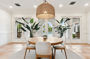 Deerfield Beach apartment for rent - a dining room with a large pendant light and a round dining table
