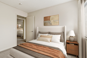 High Point apartment for rent - a bedroom with a bed and a nightstand with a lamp at Eastchester Ridge Apartments, High Point, North Carolina