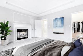 Charlotte apartment for rent - A bedroom with a large bed and a fireplace at Elan at Mallard Creek Apartment Homes, North Carolina, 28269