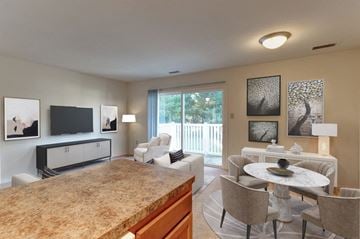 Waldorf apartment for rent - A living room with a marble table and a television.