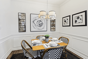 Knoxville apartment for rent - a dining room with a table and chairs and pictures on the wall