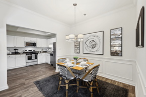 Knoxville apartment for rent - a dining room with a table and chairs and a kitchen