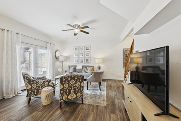 Knoxville apartment for rent - A living room with a television and a fan.