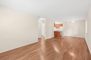 Waldorf apartment for rent - A room with wooden flooring and white walls.