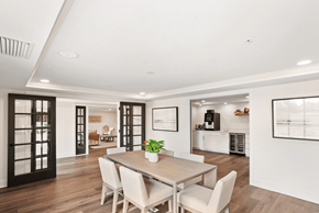 Coral Gables apartment for rent - a dining area with a wooden table and white chairs