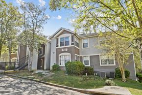 Tallahassee apartment for rent - A two-story house with a garage and a driveway.