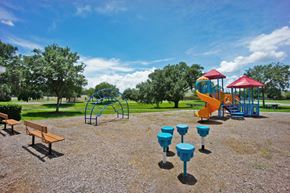Kissimmee apartment for rent - a playground with a slide and picnic table