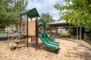 Spartanburg apartment for rent - a playground with a slide and swings at a park