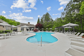Canton apartment for rent - a swimming pool with chairs and umbrellas at the resort on a sunny day