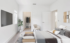 Orlando apartment for rent - Bedroom facing a bed with a sitting chair and clothes hung up in the walk-in closet