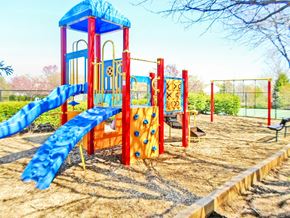 Warrenton apartment for rent - A playground with a blue slide and red climbing frame.
