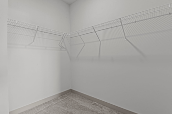 Empty room with a wire shelving unit.
