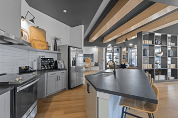 A modern kitchen with a large island in the center.