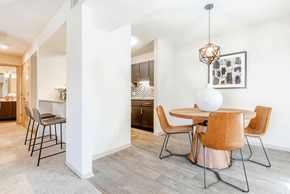 Charlotte apartment for rent - A dining room with a white table and chairs at Madison Southpark Apartment Homes, Charlotte, NC, 28226