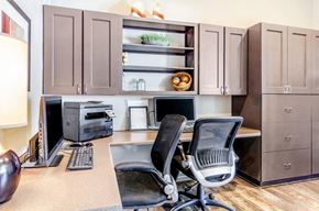 Federal Heights apartment for rent - Resident Business Center with Grey Counters , Computers, Printer and Rolling Chairs Under Wood Cabinets