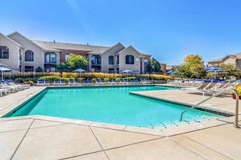 Two swimming pools with expansive sundeck seating