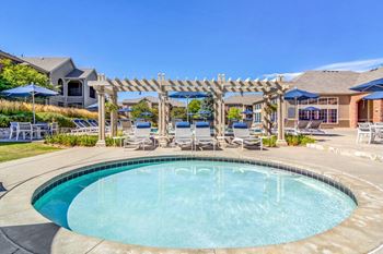 Two swimming pools with expansive sundeck seating