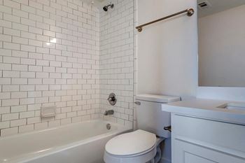 Iced white quartz counters in kitchen and bath