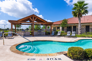 Resort-style swimming pool with sundeck