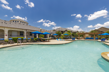 Resort-style swimming pool with sundeck