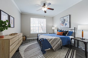 Houston apartment for rent - bedroom with hardwood-style flooring and ceiling fan