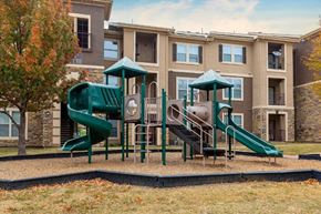 Arlington apartment for rent - Green playground with building exterior in the background