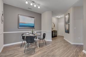 Cary apartment for rent - A dining room with a table set for four.