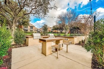 Two outdoor kitchens with gas grills