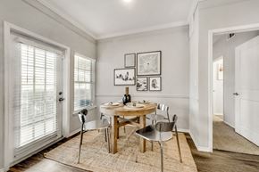 Carrollton apartment for rent - dining room table with chairs with large windows and door to outside