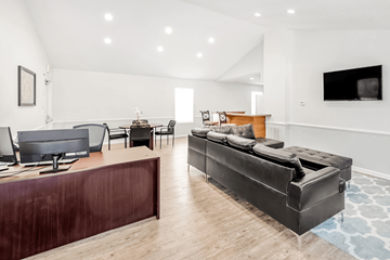 Newport News apartment for rent - a living room with a leather couch and a tv