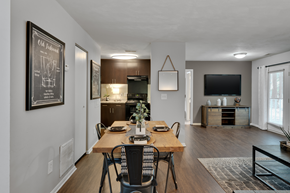 Raleigh apartment for rent - A dining room with a hardwood-style flooring, a wooden table and chairs.