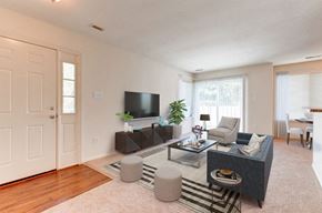 Waldorf apartment for rent - a living room with white walls and a sliding glass door
