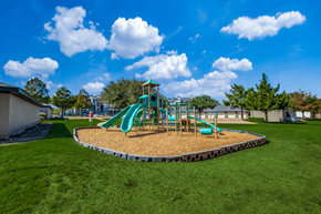 Roanoke apartment for rent - A playground with a green slide and a sandbox.
