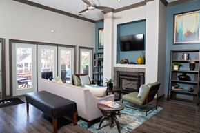 Durham apartment for rent - A living room with a fireplace, a chair, a sofa, and a coffee table.