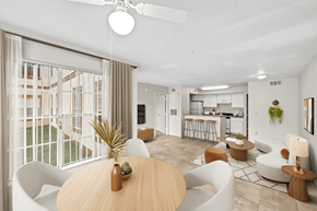 Orlando apartment for rent - a living room with a large window and a kitchen in the background