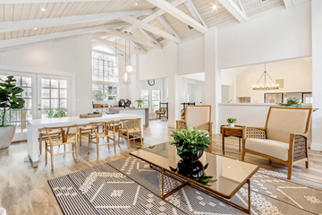 Tampa apartment for rent - A living room with a white ceiling and a rug with a black and white pattern.