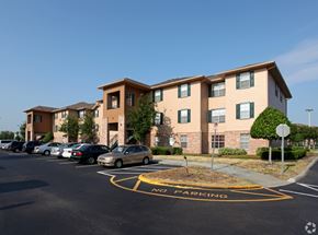 Orlando apartment for rent - A parking lot with a yellow "No Parking" sign in the middle.