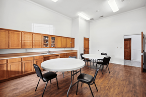 Dallas apartment for rent - a dining room with a table and chairs and a kitchen