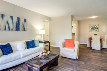 Hixson apartment for rent - A living room with a white couch and a coffee table.
