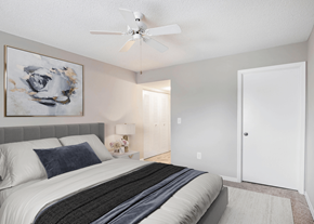 Coconut Creek apartment for rent - a bedroom with a bed and a ceiling fan