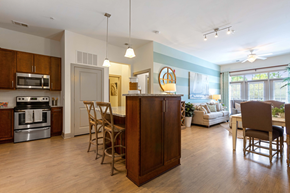 Wilmington apartment for rent - A kitchen with wooden cabinets and a large island.