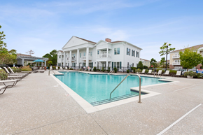 Wilmington apartment for rent - A large white house with a pool in front.